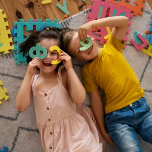 Model wearing minimalist watch with black wristband and white watch face.